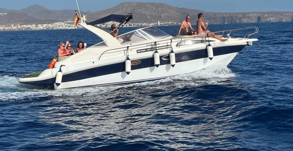 A small charter boat with a handful of guests off the coast of Tenerife