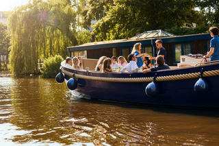 Amsterdam: City Highlights Small Boat Canal Cruise with host