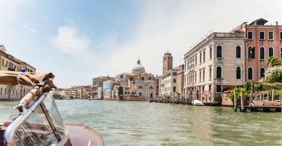 Water taxi crossing the lagoon beside the dock at Venice Marco Polo Airport
