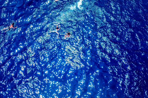 Mykonos: Prywatna wycieczka katamaranem o poranku lub o zachodzie słońca