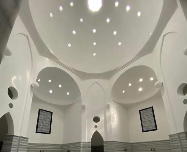 Warm marble washing room with stone basins inside a traditional Turkish hamam