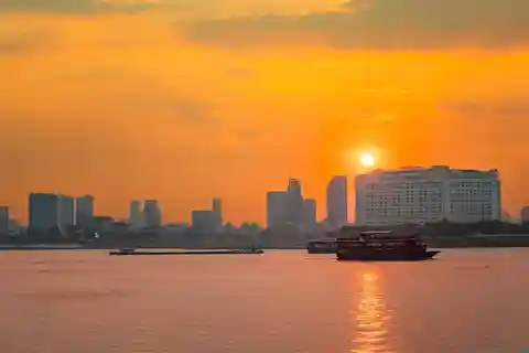 Phnom Penh Sunset Cruise & Evening City Tour Vespa Adventure