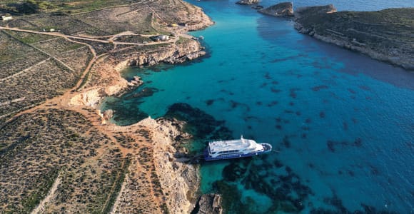 Bugibba: Sunset Cruise to Blue Lagoon, Caves, Crystal Lagoon