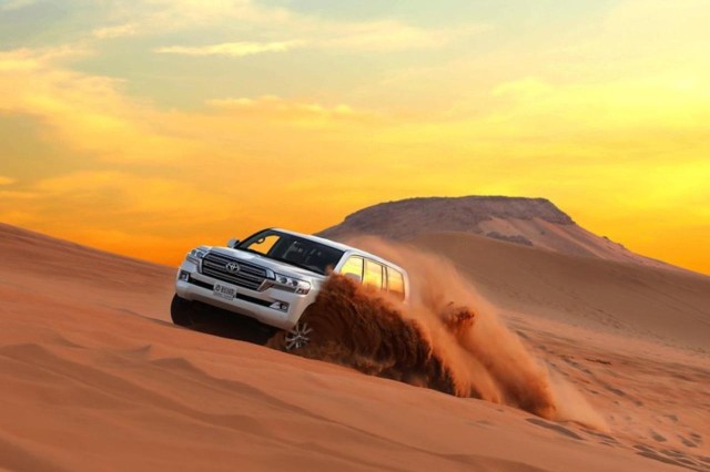 Visit Dubai Desert Tour, Dinner, Shows, Camel & Sandboard Drive in Dubai