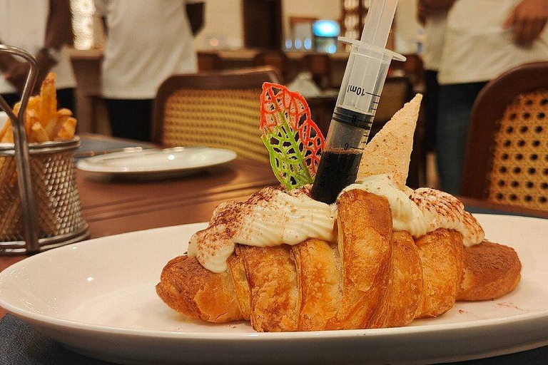 BAO-spel och swahili-kaffeprovning på ZanzibarBAO: Spel- och swahilikaffesmakning på Zanzibar.