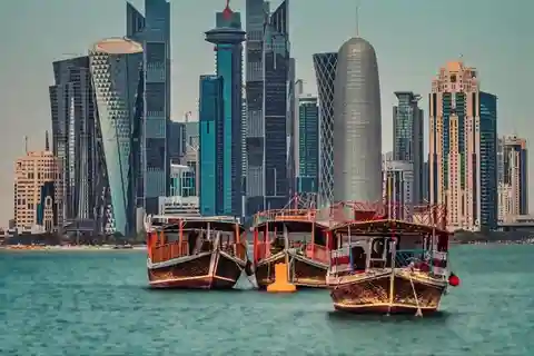 Doha: traditional Dhow Harbour, Skyline view , Sunset