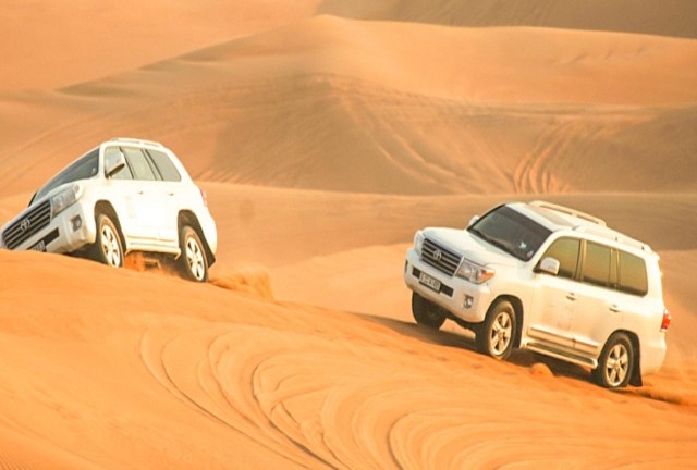 Visit Dubai Desert Safari, Camel ride, BBQ, Shows & Hena Painting in Dubai