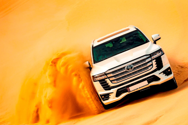 Doha: Arabic Costume, Desert Safari, Sandboarding & More Group Tour with Camel Ride in traditional Arabic Costume