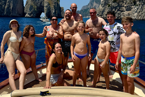 Capri Boat Tour with Caves, Swimming, Aperitif and Champagne From Capri: PRIVATE Capri Boat Tour
