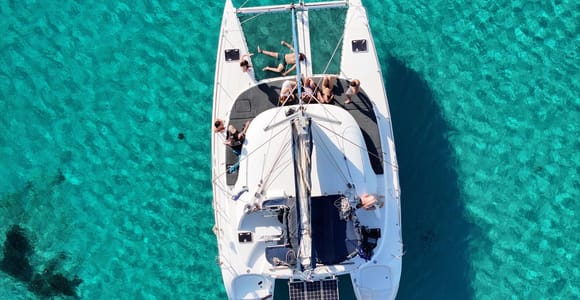 From Ornos: Mykonos Delos Catamaran Cruise with Meal & SUP