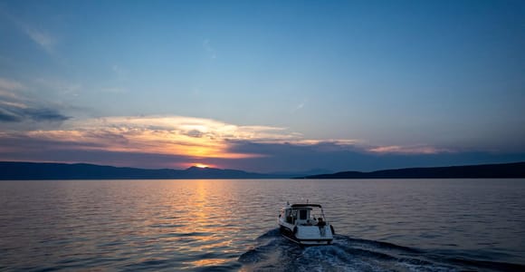 Krk: Private Sunset Cruise to Plavnik Island with Swimming