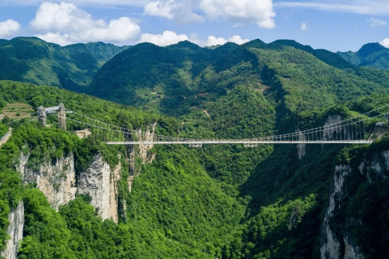 Excursão à ponte de vidro do Grand Canyon de Zhangjiajie e à caverna HuanglongGrand canyon glass birdge huanglong cave from Zhangjiajie