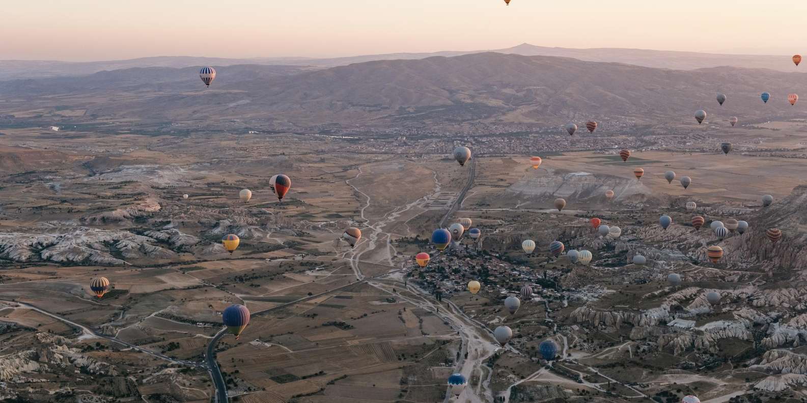BalonFest 2025 — 38 special-shape balloons from 27 countries fly over Cappadocia's fairy chimneys during the Flight of Nations, August 7–10 2025