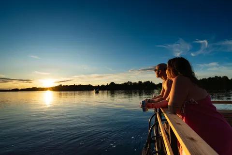 Rovaniemi: Half-day or evening on a floating sauna, swimming and BBQ
