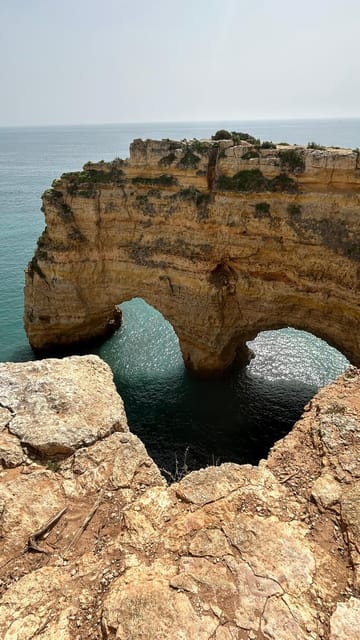 From Faro: Guided Caves, Beaches, Swimming & Hiking Day Tour | GetYourGuide