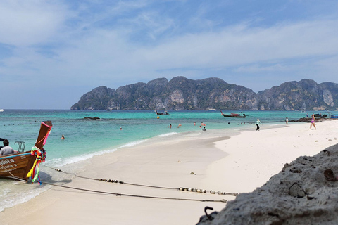 Phi Phi: 7 Islands longtail boat with Sunset and Plankton