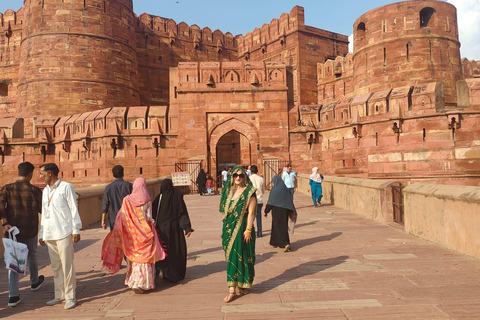 From Delhi: Sunrise Taj Mahal & Agra Fort Day Trip by AC Car Tour Guide Services Only