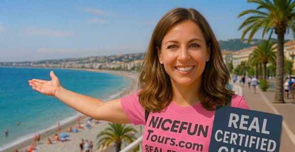 A smiling city guide pointing to the seafront promenade and pebble beach of Nice