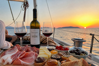 Elba Island Sea Community: Sunset Gathering on a Sailboat