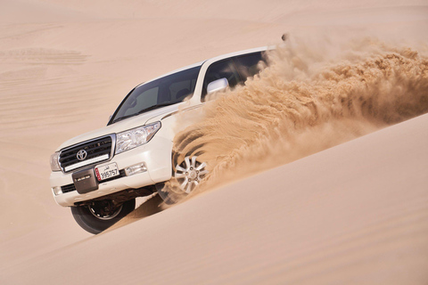 Doha: Safari privado por el desierto con paseo en camello y Sandboarding