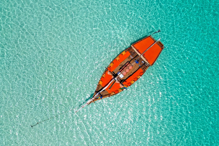 Mnemba Island Dhow Snorkeling, Dolphins, Bbq Lunch, Sailing Sharing Mnemba Island Snorkeling Trip with Bbq Lunch