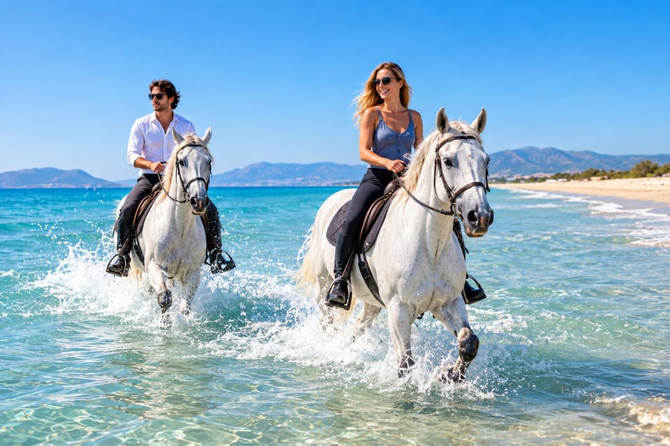 Riders on horses walking through shallow water beside a Bodrum beach