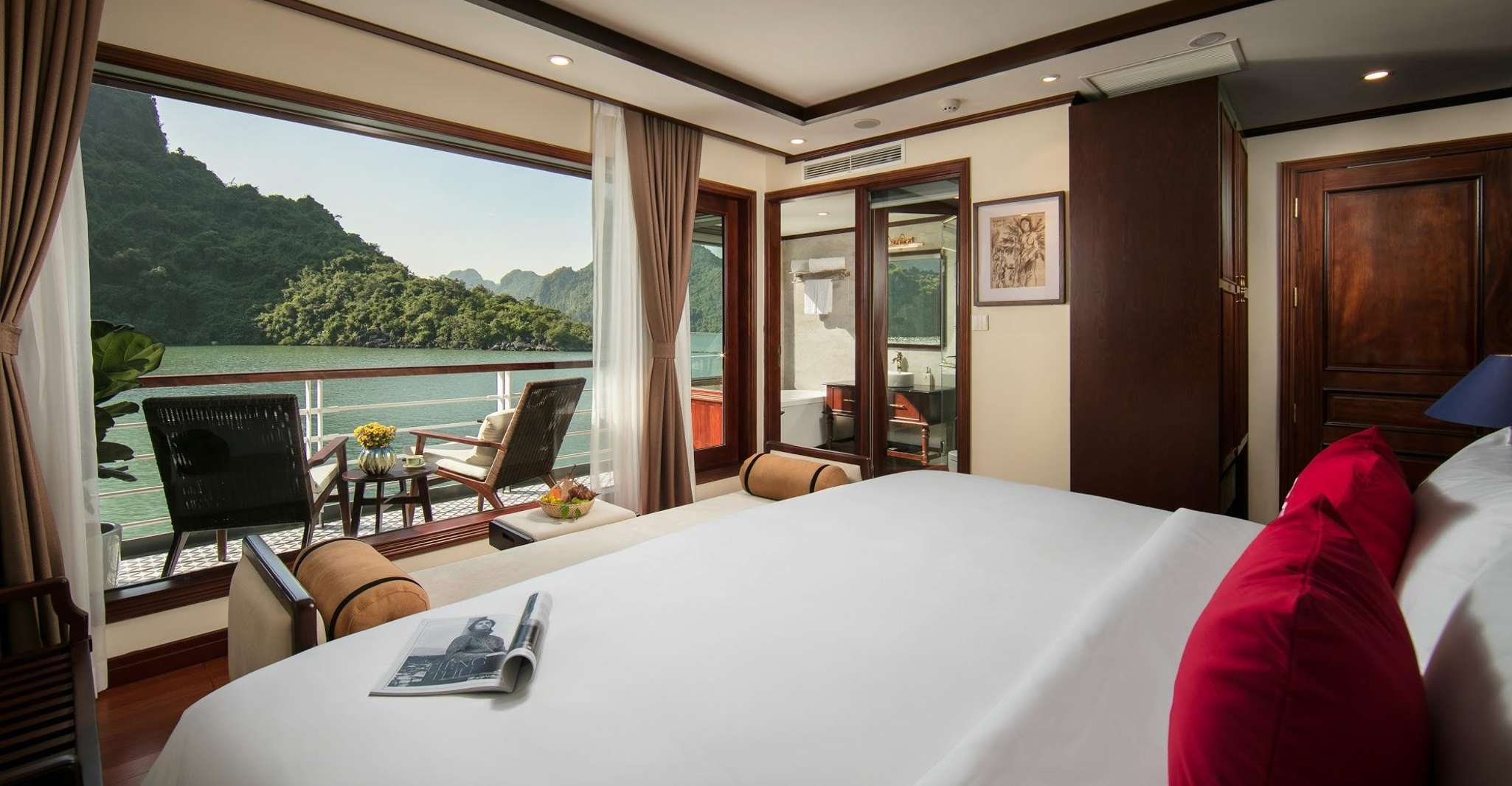 Boats cruising between limestone islands in Ha Long Bay