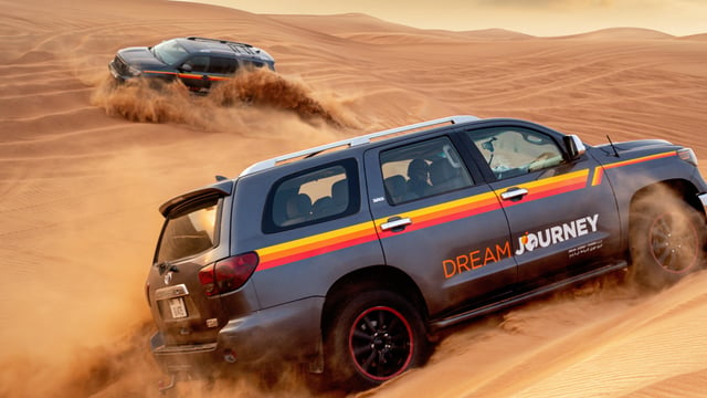 Découverte du désert de Dubaï : Safari dans les dunes rouges, planche à sable et chameaux