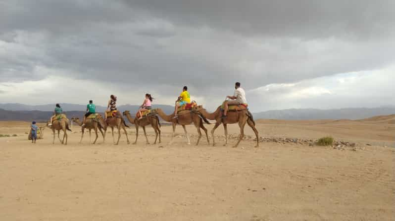 From Marrakech: Agafay Desert Camel Ride And Berber Dinner | GetYourGuide