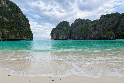 From Phi Phi: Iconic Bays by Longtail—Beach, Lagoon, Snorkel Phi Phi: Longtail Join Trip — Bays, Beach & Snorkeling