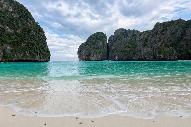 From Phi Phi: Iconic Bays by Longtail—Beach, Lagoon, Snorkel Phi Phi: Longtail Join Trip — Bays, Beach & Snorkeling