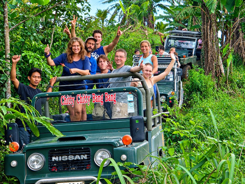 An open four-wheel-drive vehicle on a green mountain road in Koh Samui