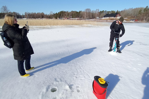 From Helsinki, Ice fishing experience with meal and drink.