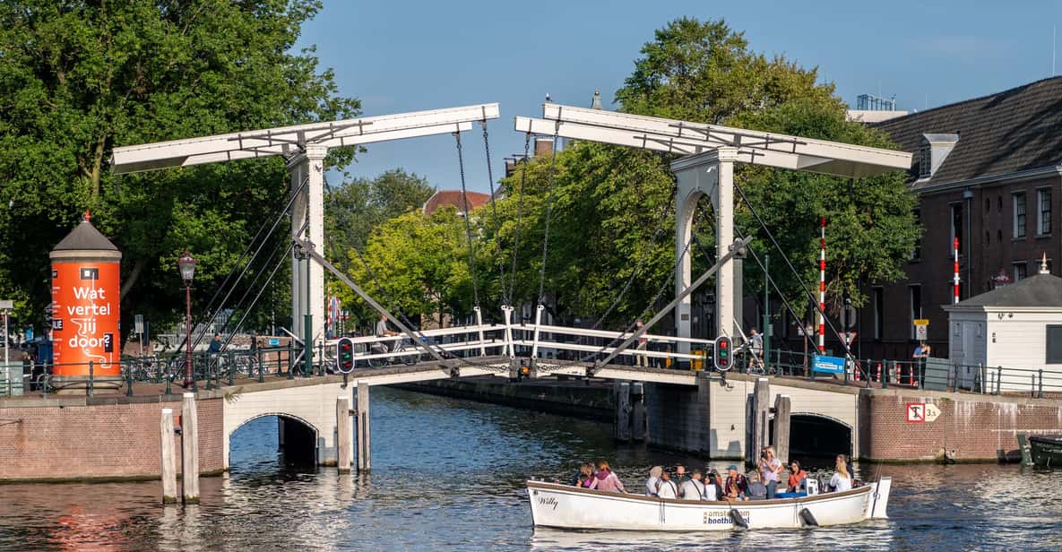 Afbeelding 4 van Amsterdam: Grachtenrondvaart met gids in een open boot langs hoogtepunten