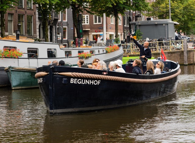 Visit Amsterdam Electric Tugboat City Cruise with Drinks Option in Amsterdam
