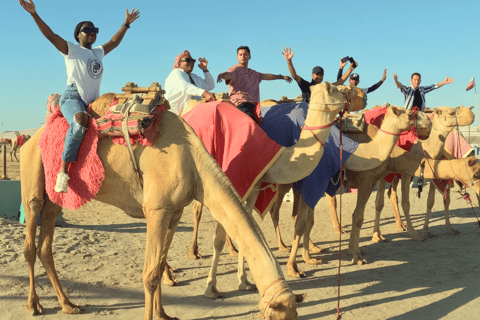 Qatar: Safari nel deserto al tramonto con giro in cammello e sandboarding....Tour di condivisione