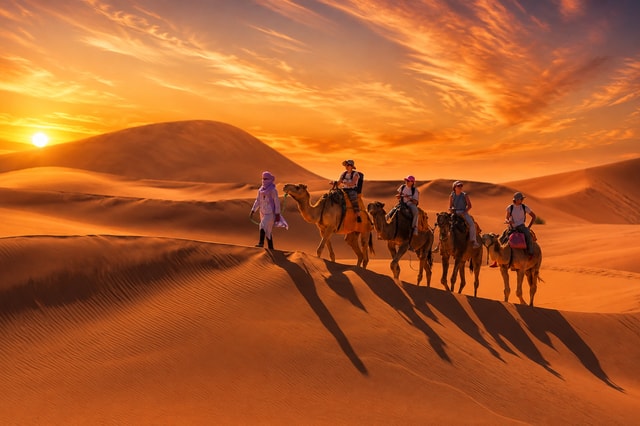From Merzouga: Sunset Camel Trek with Optional Sandboarding