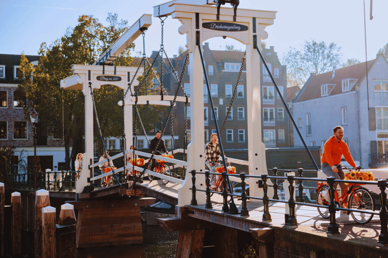 Amsterdam: Top Highlights Guided Bike Tour EN/DE/ES/FR/IT/CN Bike Tour with Guide & Audio Guide in DE, ES, FR, IT, and CN