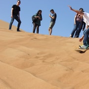 Dubai Sandboarding Camel Ride And Red Dune Bashing Safari Getyourguide