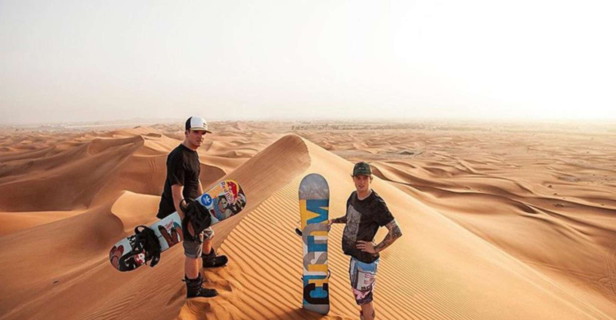 Dubai, Desert Safari, BBQ, Spectacles, Camel Ride & Sand Boarding - Hizvo