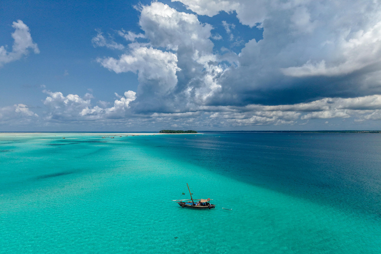 Mnemba Island Dhow Snorkeling, Dolphins, Bbq Lunch, Sailing Sharing Mnemba Island Snorkeling Trip with Bbq Lunch