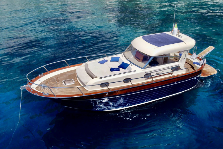 Capri Boat Tour with Caves, Swimming, Aperitif and Champagne From Capri: PRIVATE Capri Boat Tour