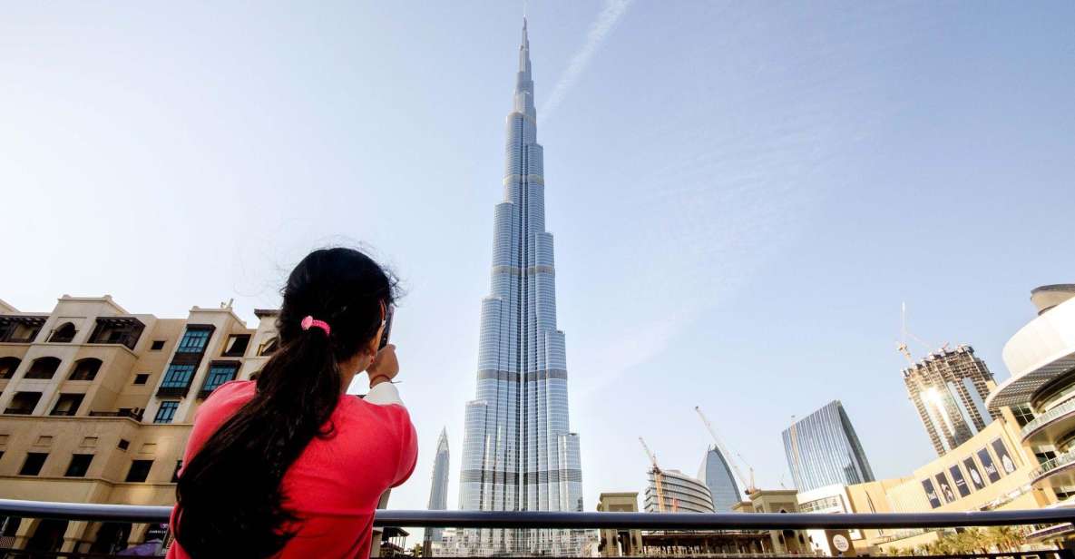 Premium Photo  Happy woman walking in dubai with burj khalifa skyscraper  in the background