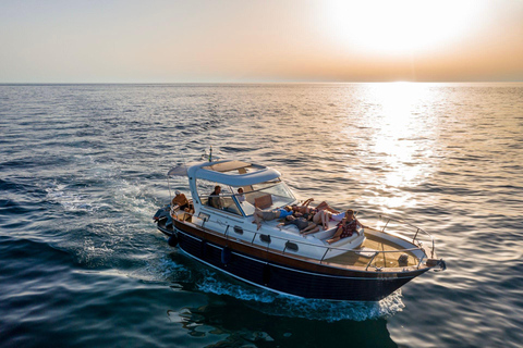 Capri Boat Tour with Caves, Swimming, Aperitif and Champagne From Capri: PRIVATE Capri Boat Tour