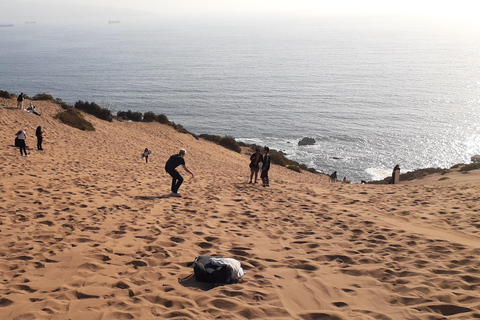 Sandboarding e pôr do sol nas dunas de ConconPôr do sol nas dunas de areia de Concon