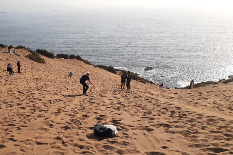 Sandboarding and sunset in Concon Sand dunesSunset in Concon Sand dunes