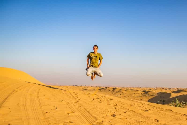 From Dubai: Desert Safari, BBQ, Quad Biking, Shisha & Drinks | GetYourGuide