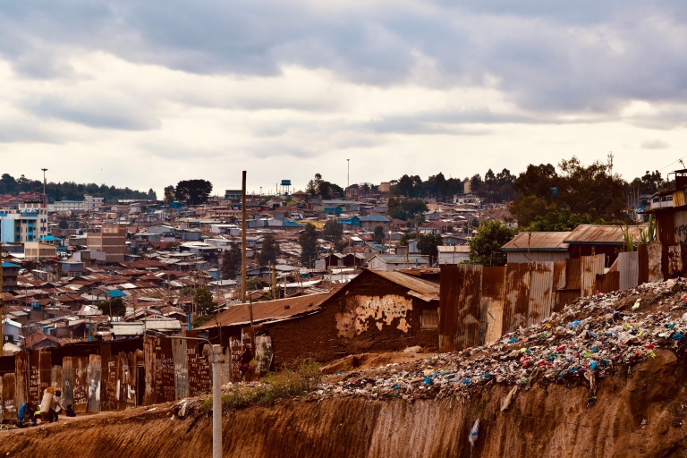 Visit a local Bar, Seeing the overview of the slum, Walking.