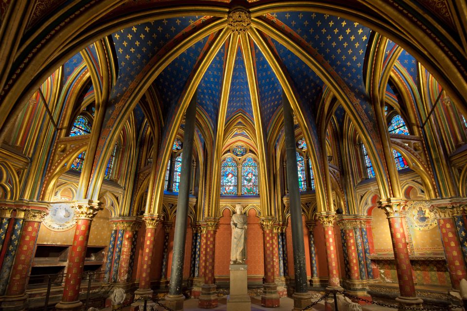 Interior of Sainte Chapelle in Paris, France - A Magnificent Gothic Chapel Featuring Elaborate Stained Glass Windows Depicting Scenes from the Bible and Religious Artifacts