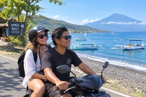 Explore More of Amed Beach with a Local Scooter Driver